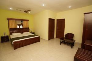 Postel nebo postele na pokoji v ubytování Lloyds Serviced Apartments,Krishna Street,T Nagar