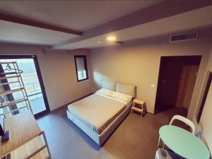 Posteľ alebo postele v izbe v ubytovaní Dannunziano Aparthotel