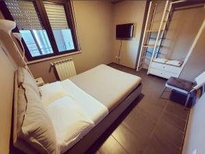Posteľ alebo postele v izbe v ubytovaní Dannunziano Aparthotel