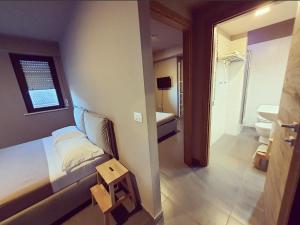 Posteľ alebo postele v izbe v ubytovaní Dannunziano Aparthotel