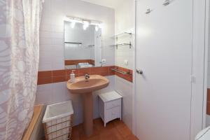 a bathroom with a sink and a mirror at Desconnectar Tossa de Mar in Tossa de Mar
