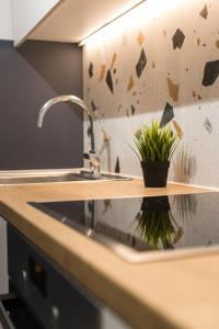 A kitchen or kitchenette at Serene 1 BR Apartment in Koukaki by UPSTREET