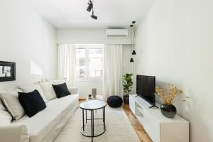A seating area at Serene 1 BR Apartment in Koukaki by UPSTREET