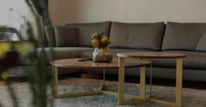 a living room with a couch and two tables at Maslak Aparts in Istanbul