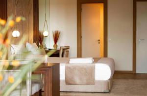 a hotel room with a bed and a desk and a room at Maslak Aparts in Istanbul