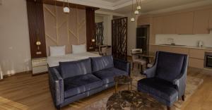 a living room with a bed and a couch at Maslak Aparts in Istanbul