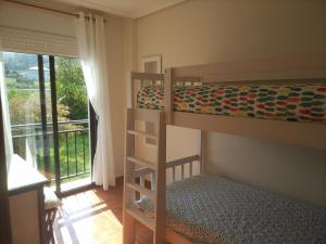 Ένα ή περισσότερα κρεβάτια σε δωμάτιο στο Apartamento Paseo Marítimo