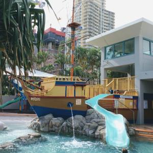 a slide and a pirate ship in a water park at Crown Towers Resort Private Apartments in Gold Coast