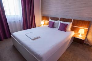 Postel nebo postele na pokoji v ubytování Hotel Bordeaux