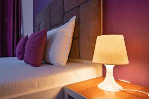 Postel nebo postele na pokoji v ubytování Hotel Bordeaux