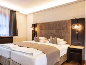 Posteľ alebo postele v izbe v ubytovaní Seiblishof Superior Hotel Ischgl