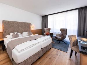Posteľ alebo postele v izbe v ubytovaní Seiblishof Superior Hotel Ischgl