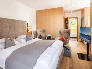 Posteľ alebo postele v izbe v ubytovaní Seiblishof Superior Hotel Ischgl
