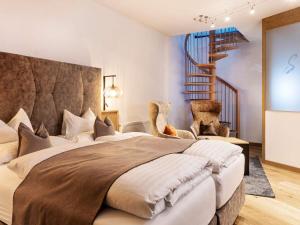 Posteľ alebo postele v izbe v ubytovaní Seiblishof Superior Hotel Ischgl