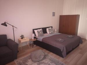 Posteľ alebo postele v izbe v ubytovaní Palace - Belvárosi Apartman Eger