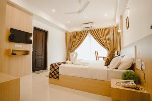 Athirappilly Rainland Resort客房内的一张或多张床位