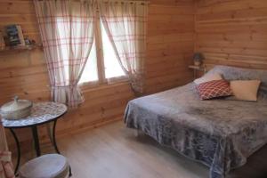 Ένα ή περισσότερα κρεβάτια σε δωμάτιο στο La palmeraie