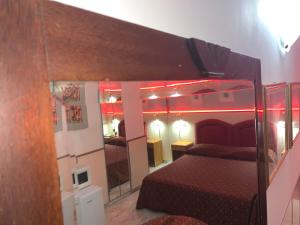 Postel nebo postele na pokoji v ubytování Hotel Malpensafiera