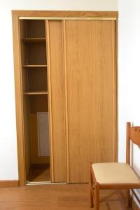 a cupboard with a door open in a room at Hotel Ancora da Ria 1* Superior in Porto do Son