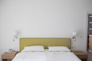 Posteľ alebo postele v izbe v ubytovaní Hotel Savoy
