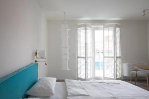 Posteľ alebo postele v izbe v ubytovaní Hotel Savoy