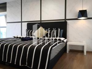 a bedroom with a black and white striped bed at Pinnacle PJ, Romantic City View, 1-4 Guests Designed Duplex Home by Flexihome-MY in Petaling Jaya