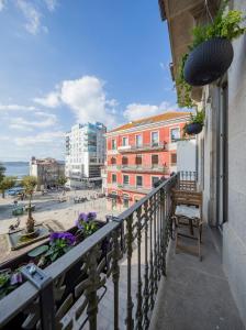 a balcony with a view of a city with buildings at Refugio de paz y encanto en el corazón de Vigo by Prishomes in Vigo