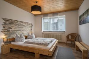Postel nebo postele na pokoji v ubytování Ferienwohnung im Haus Metzger
