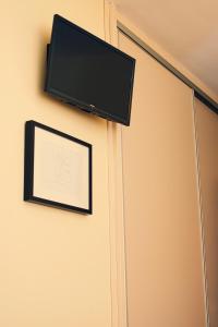 Μια τηλεόραση ή/και κέντρο ψυχαγωγίας στο Apartamentos Turísticos Ceres