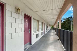 an empty hallway of a building with a purple door at Econo Lodge Easton Route 50 in Easton