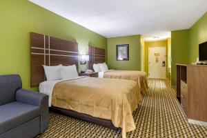 Postel nebo postele na pokoji v ubytování Quality Inn Brunswick