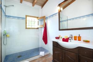a bathroom with a sink and a shower at Villa BURGUES in Alcudia +10 photos