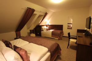 Posteľ alebo postele v izbe v ubytovaní Hotel Sladovna