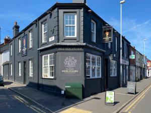 a black building on the side of a street at The Sutherland Arms in Stoke on Trent