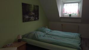 Postel nebo postele na pokoji v ubytování Ferienwohnung Fusi