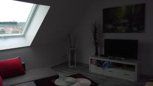 TV a/nebo společenská místnost v ubytování Ferienwohnung Fusi + 5 fotografií
