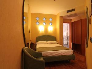 Postel nebo postele na pokoji v ubytování SIRIOHotel