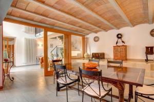 a dining room with a table and chairs at Villa LLOBINER in Pollença