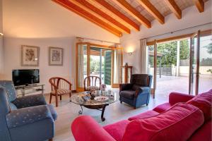 a living room with a couch and a table at Villa LLOBINER in Pollença