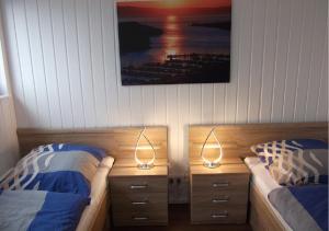 Postel nebo postele na pokoji v ubytování Schwimmendes Ferienhaus Swimming Lounge