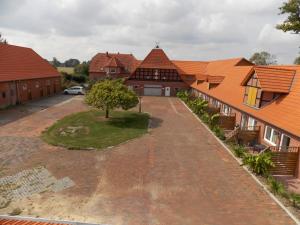 an overhead view of a row of houses with orange roofs at Angelhof Weseloh Appartement in Bruchhausen-Vilsen