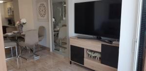 A television and/or entertainment centre at PARQUE SANTIAGO 1 LUXURY APARTAMENT (Playa de las Américas)