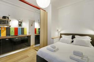 เตียงในห้องที่ A Sweet Studio in Montparnasse - Boulevard du Montparnasse