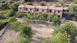 an aerial view of a house with trees at Hotel Rural La Marmita de Ahlam in Fondón