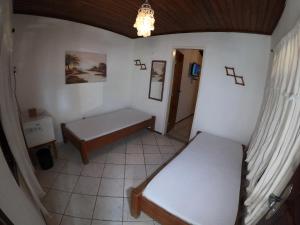 Postel nebo postele na pokoji v ubytování Pousada Casa Do Angelo