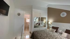 A bed or beds in a room at PARQUE SANTIAGO 1 LUXURY APARTAMENT (Playa de las Américas)