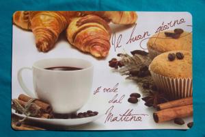 a plate with a cup of coffee and croissants at Casale san Pietro in Otricoli
