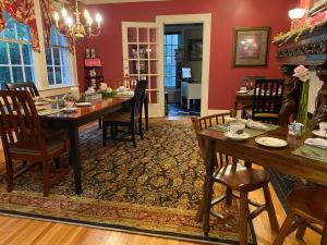 a dining room with a table and chairs at Pettigru Place Bed & Breakfast in Greenville