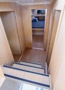 a view of a room with three stairs in a boat at Jacht motorowy Futura 40 FLY Grand Horizon in Wilkasy