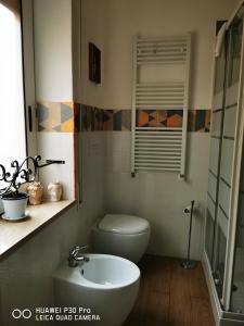 Koupelna v ubytování L'ARENA ROOM + 35 fotografií